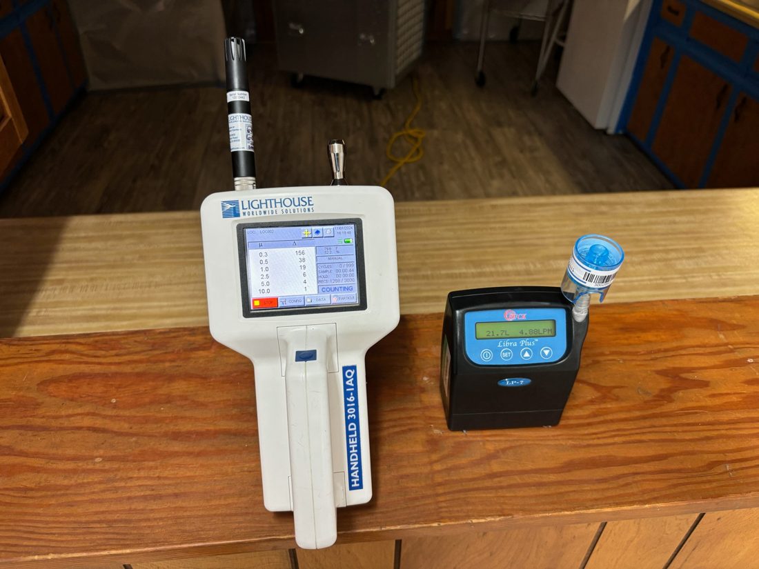 Calibrated air sampling pump collecting an indoor air sample during an ESG mold inspection