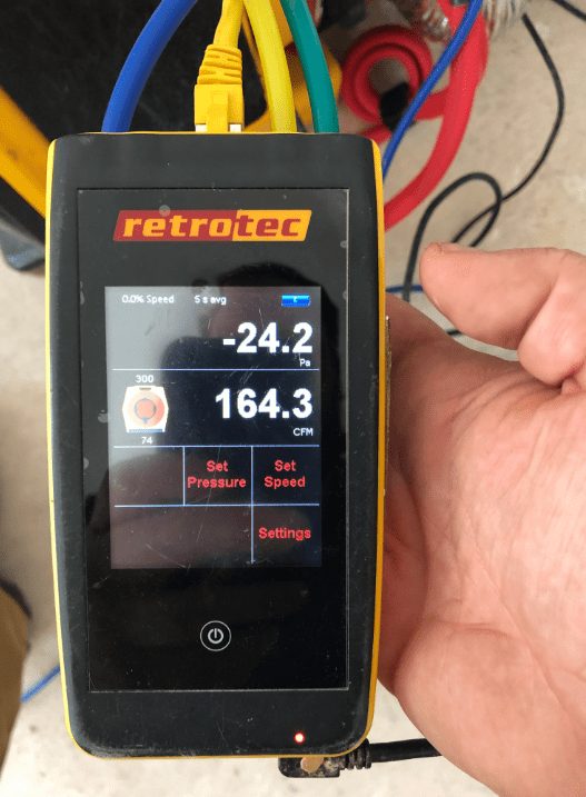 ESG field meter measuring airflow and building conditions on site