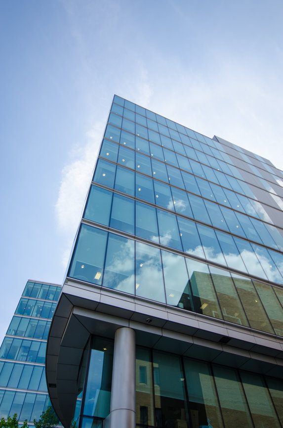 Glass commercial office building of the type ESG assesses across NC, VA and TN