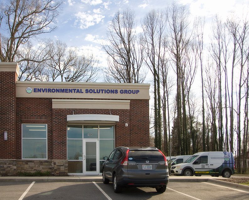 ESG office building with company vehicles parked outside in Greensboro NC